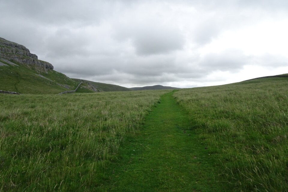 A footpath beneath a limestone scar in the Yorkshire Dales